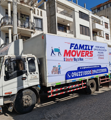 Family Movers Ethio truck with contact number and moving services branding in urban area