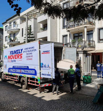 Family Movers Ethio team unloading furniture from their truck.